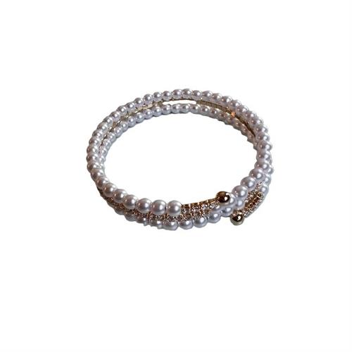 Bracciale manetta gold con un giro strass e due di perle