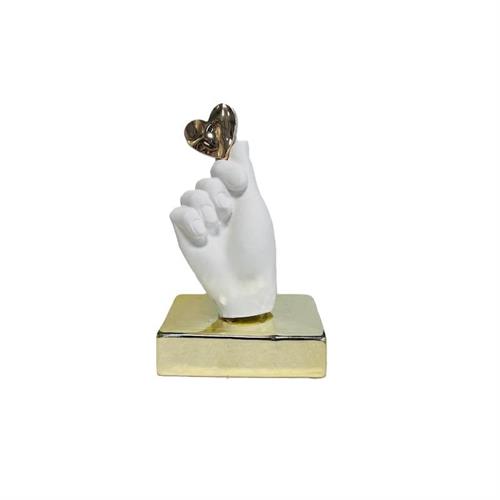 Mano di gesso su base oro con cuore oro